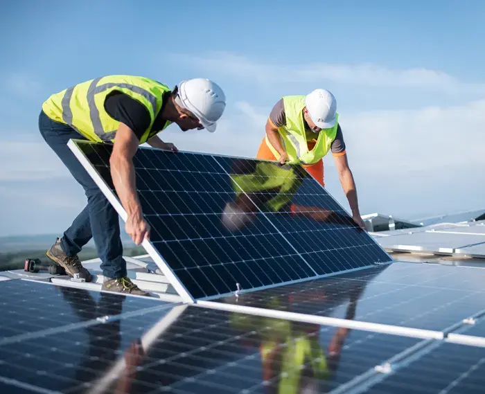 Workers installing solar panels